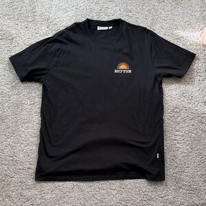 Rhythm. Black Tee with Orange Logo